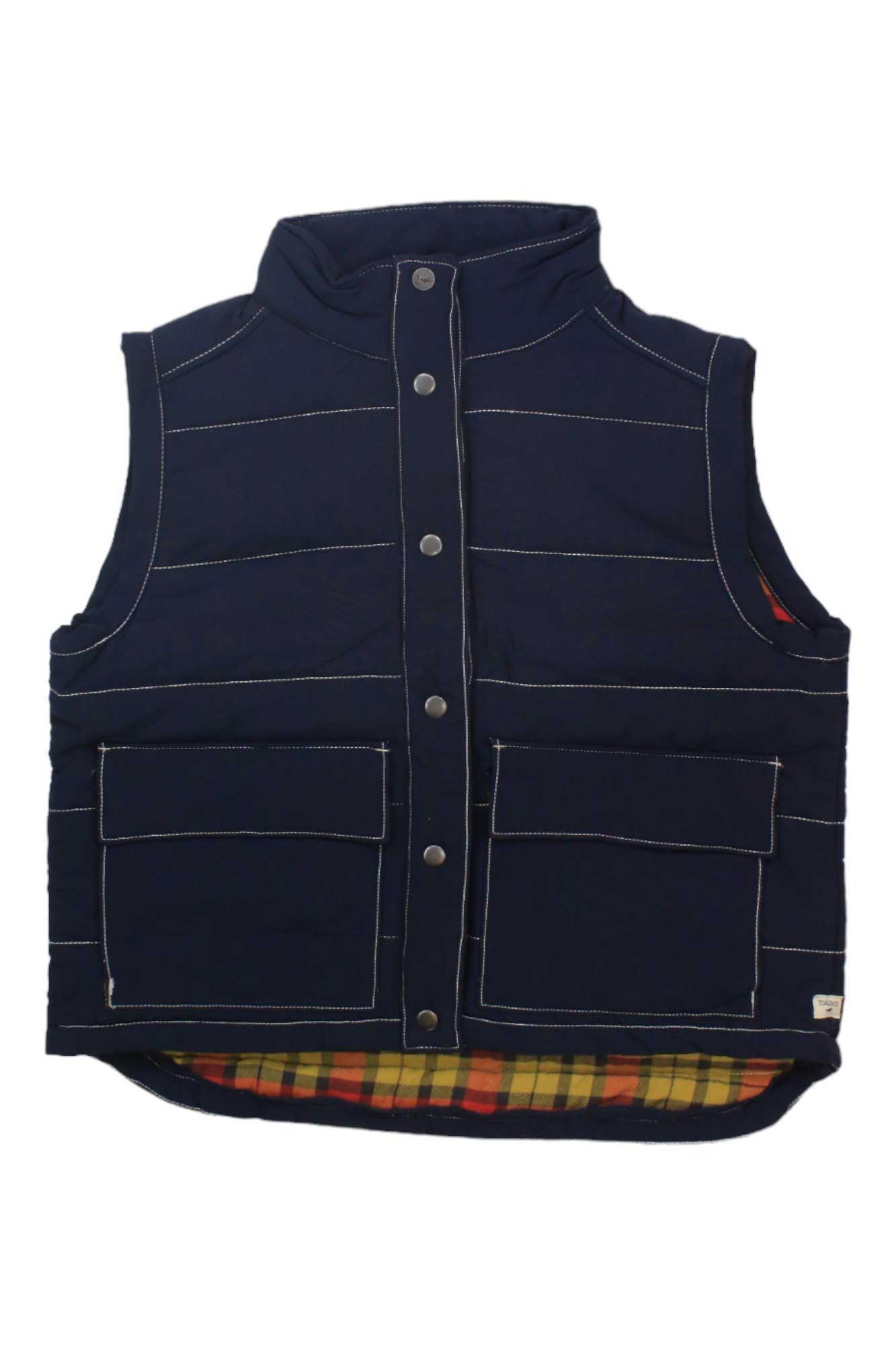 The Toad & Co Women's Forester Pass Vest is a sleeveless, navy blue, water-resistant vest featuring white stitching, front snap buttons, two large front pockets, and a visible yellow and red plaid lining at the hem.