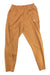 A pair of Picture Women's Tulee Stretch Pant in light brown, featuring wicking technology, an elastic waistband, and zippered pockets, laid flat on a white background.