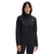 A woman with straight dark hair wears The North Face Women's TKA Glacier 1/4 Zip Top, made from recycled polyester fleece in black, standing against a plain white background and facing forward with a neutral expression.