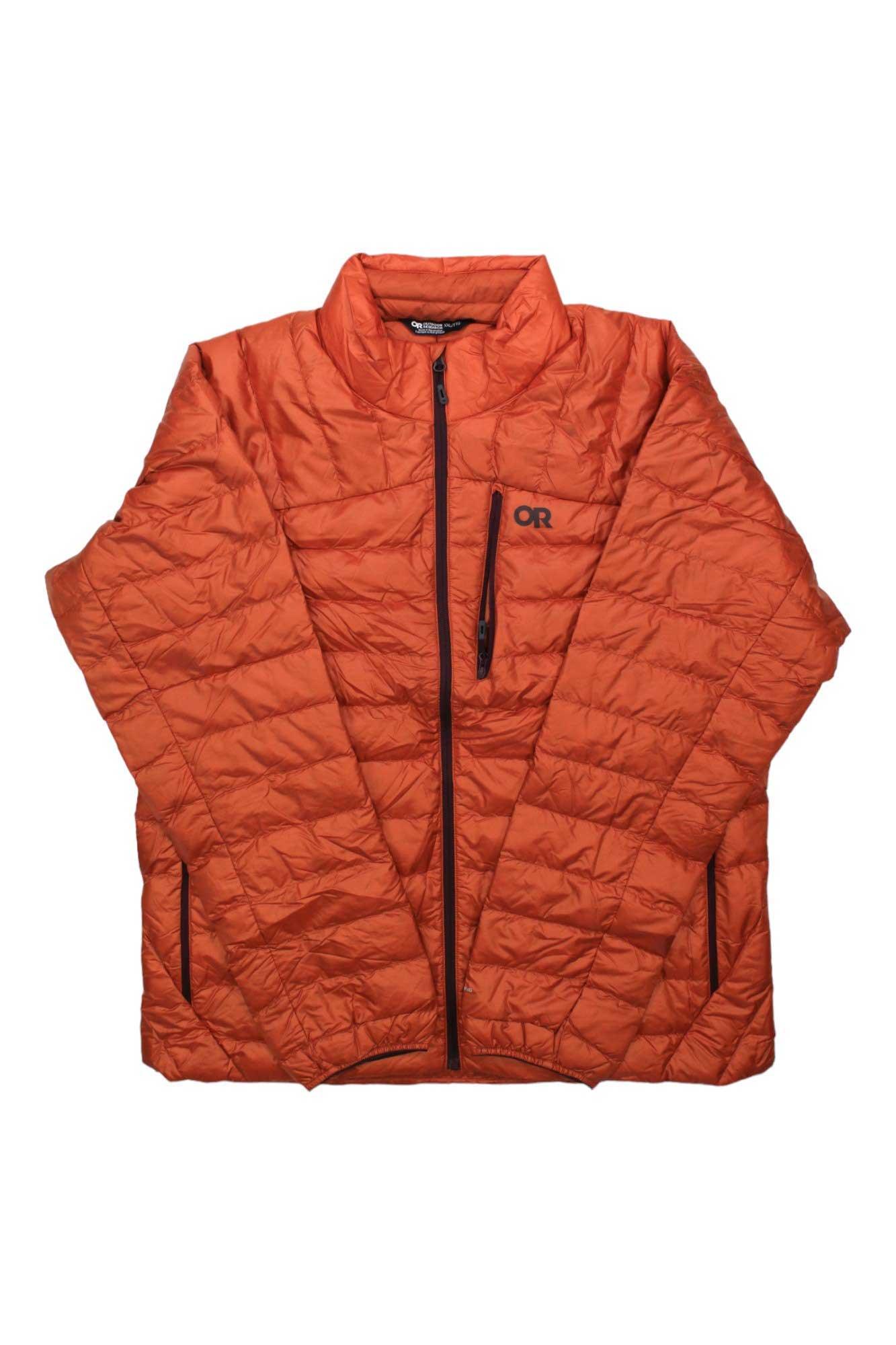 The Outdoor Research Men's Helium Down Jacket is bright orange with a front zipper, two side pockets, a chest pocket, and "OR" on the left chest. This lightweight insulated jacket offers warmth and comfort.