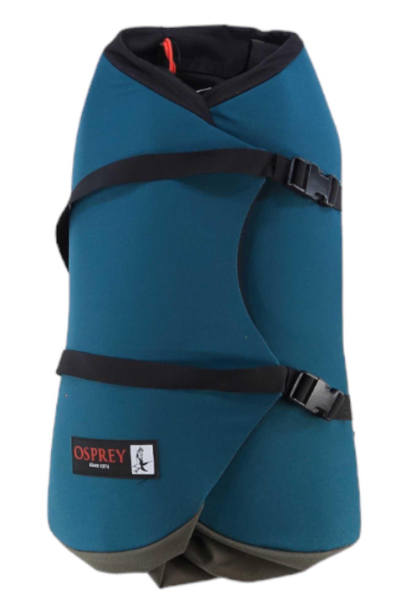A teal and black padded wrap cover with adjustable buckle straps, featuring an Osprey patch on the front. Designed to pair perfectly with the Osprey Heritage Scarab Backpack or any laptop-compatible backpack.
