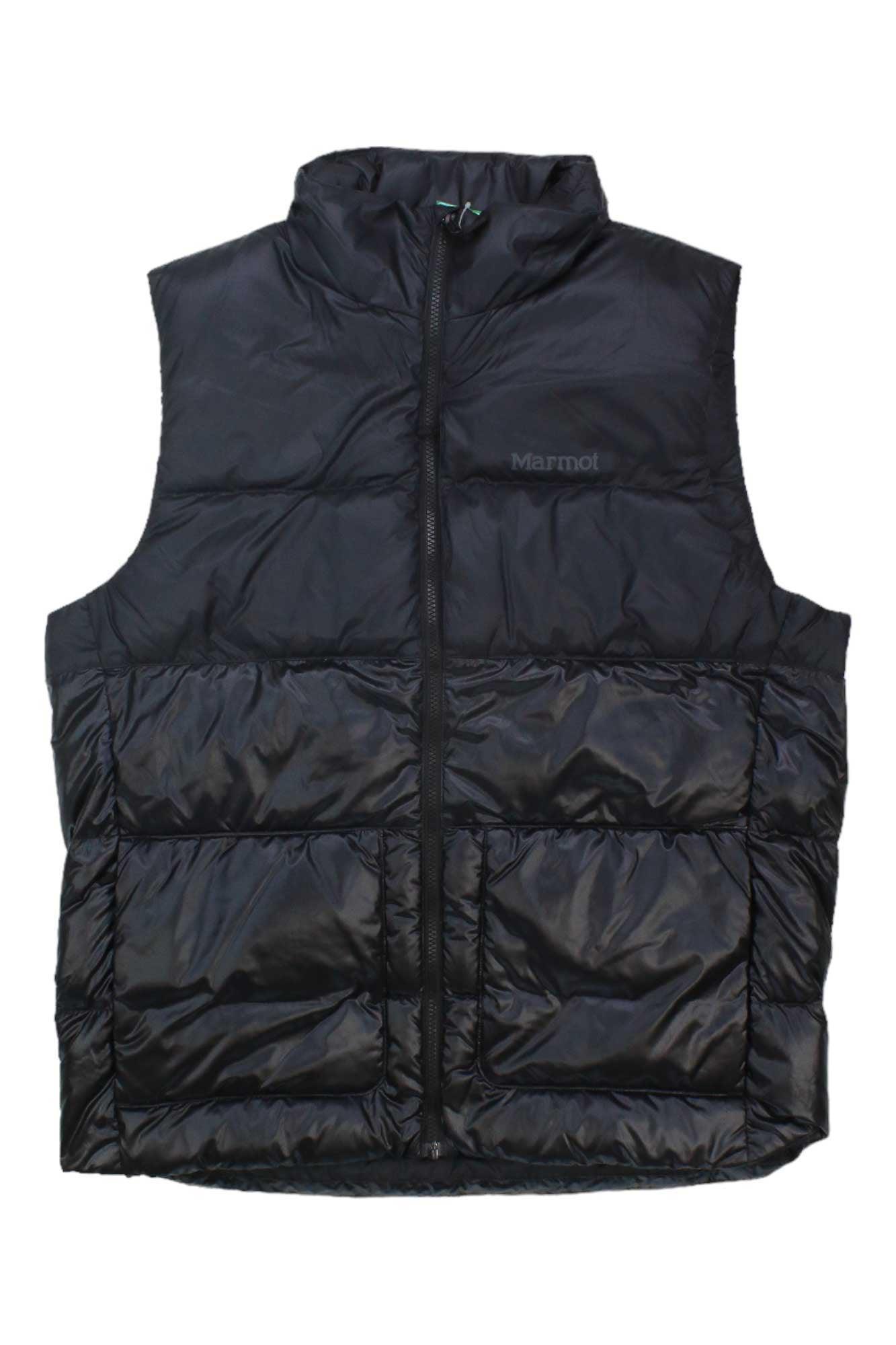 The Marmot Mens Guides Down Vest is black and sleeveless with a front zipper, two large pockets, a high collar, and a subtle Marmot logo on the upper left chest. This outdoor vest offers insulated comfort for cold weather.