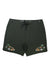 The Roark Men's Chiller 17 Inch Atoll Boardshort features dark green fabric with black drawstrings, small palm trees, leaves, and skulls on the front legs. Crafted with 4-way stretch material for maximum comfort and movement.
