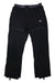 The Picture Men's Impact Pant is a pair of black hiking pants for men, made from recycled polyester, with zippered pockets, snap-button waistband with branding, adjustable cuffs, and a logo patch on the left thigh.