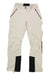 The Salewa Womens Sella DST Pant, shown flat on a white background, features beige mountaineering style with black knee patches, black zip pockets with orange pulls, water-repellent 4-way stretch fabric, and a snap-button waistband.