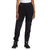 A person wearing The North Face Women's Denali Pant with reinforced knee patches, black hiking boots, and a white shirt stands against a plain white background.