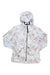 The Picture Women's Scale Jacket is a lightweight, waterproof jacket with a full zip front, beige and light blue leafy pattern, two front pockets, and a small chest logo.