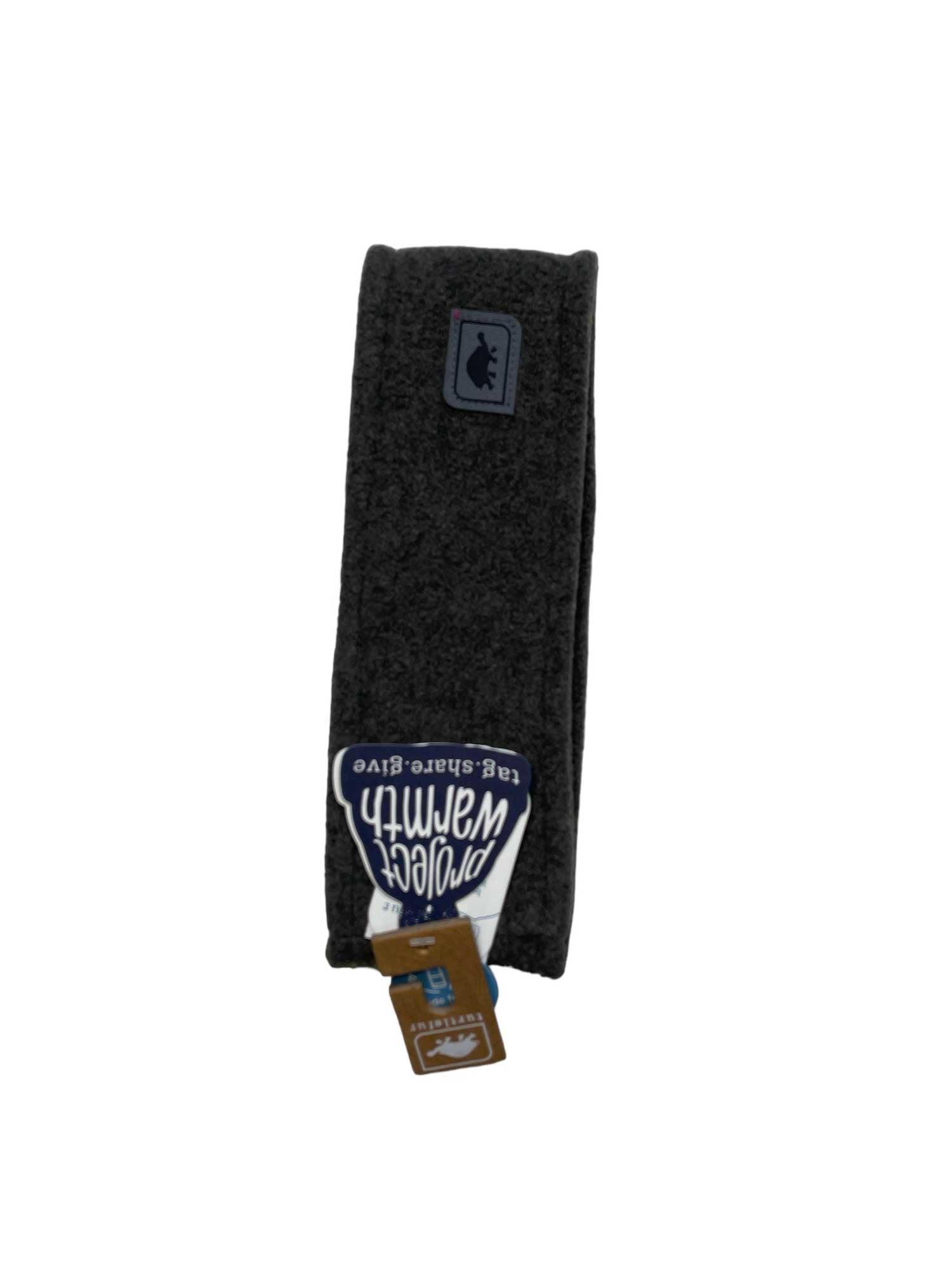 The Turtle Fur Chelonia 150 Double Layer Band is a dark gray fleece headband with sun protection, featuring a small bear logo patch and a "protec warmth" tag—ideal for winter camping and shown against a white background.