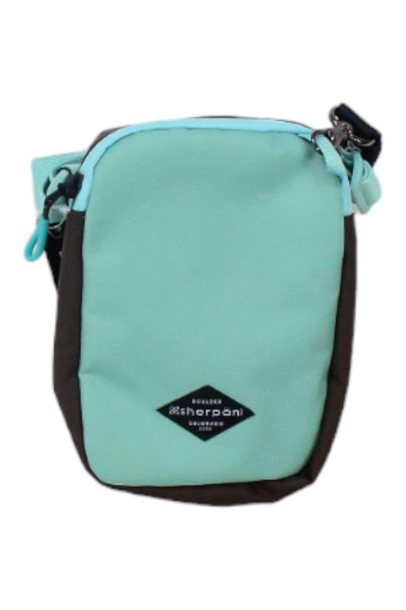 The Sherpani Women's Rogue Mini Crossbody Bag is a small, rectangular bag made from recycled polyester, featuring a light teal front, black sides, a black zipper, and a diamond-shaped logo patch—ideal for stylish women.