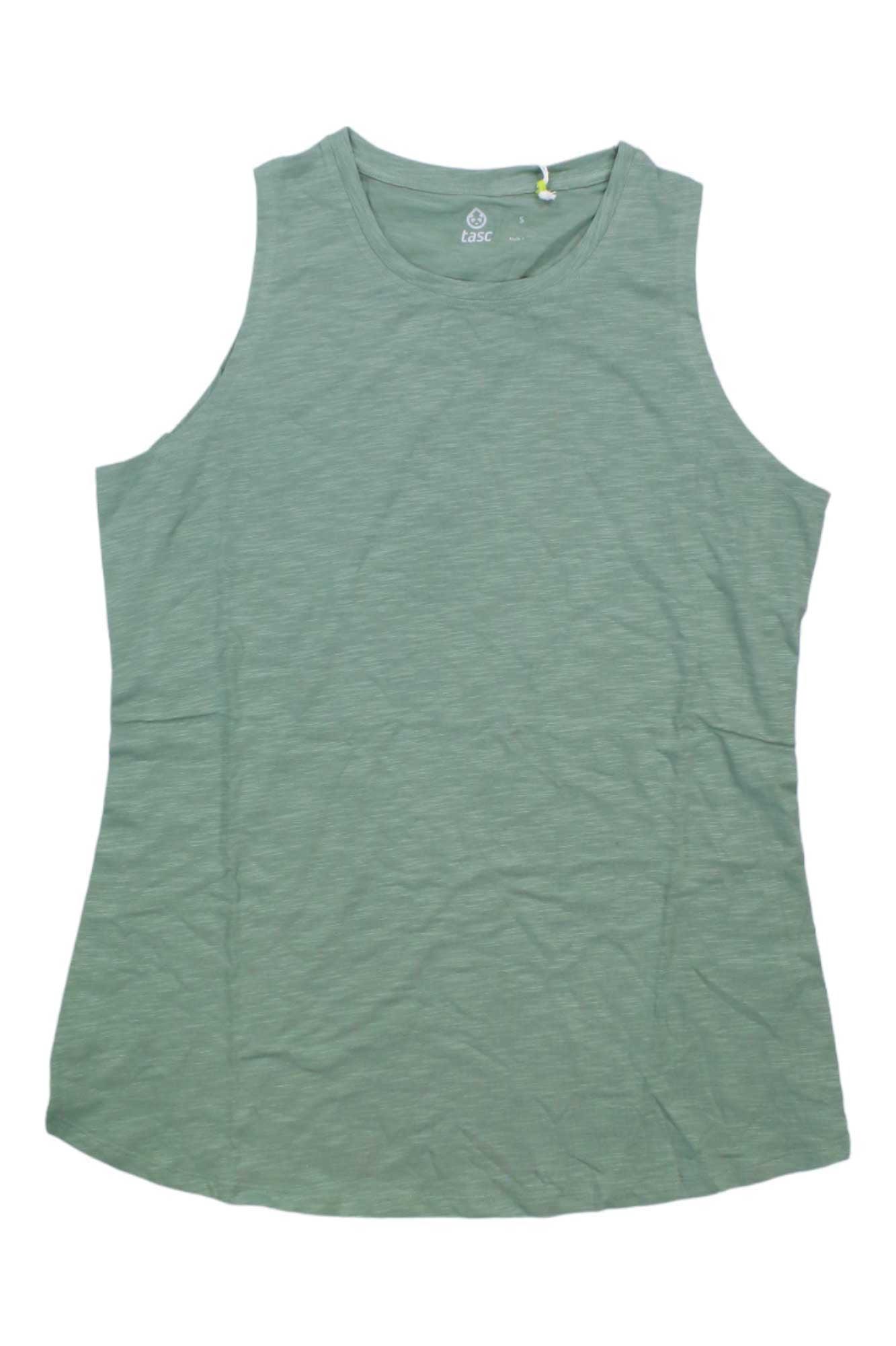 The Tasc Women's Nola Tank Top in light green is sleeveless and laid flat on a white background. It features moisture-wicking, soft fabric with a rounded neckline for a relaxed fit.