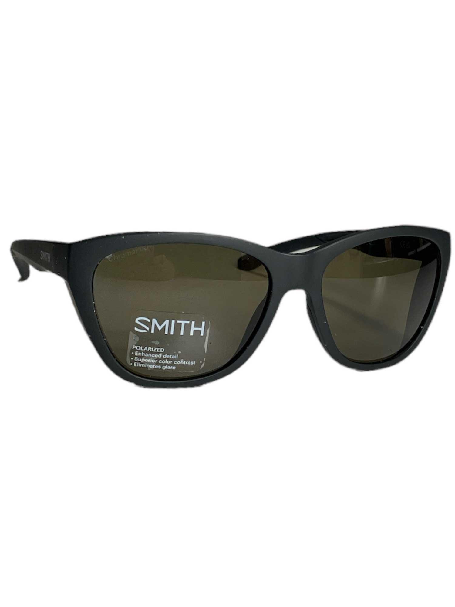 A pair of Smith Shoal Polarized Sunglasses in black featuring a sleek wraparound fit, dark lenses, and the “SMITH” logo on the left lens, displayed against a plain white background.