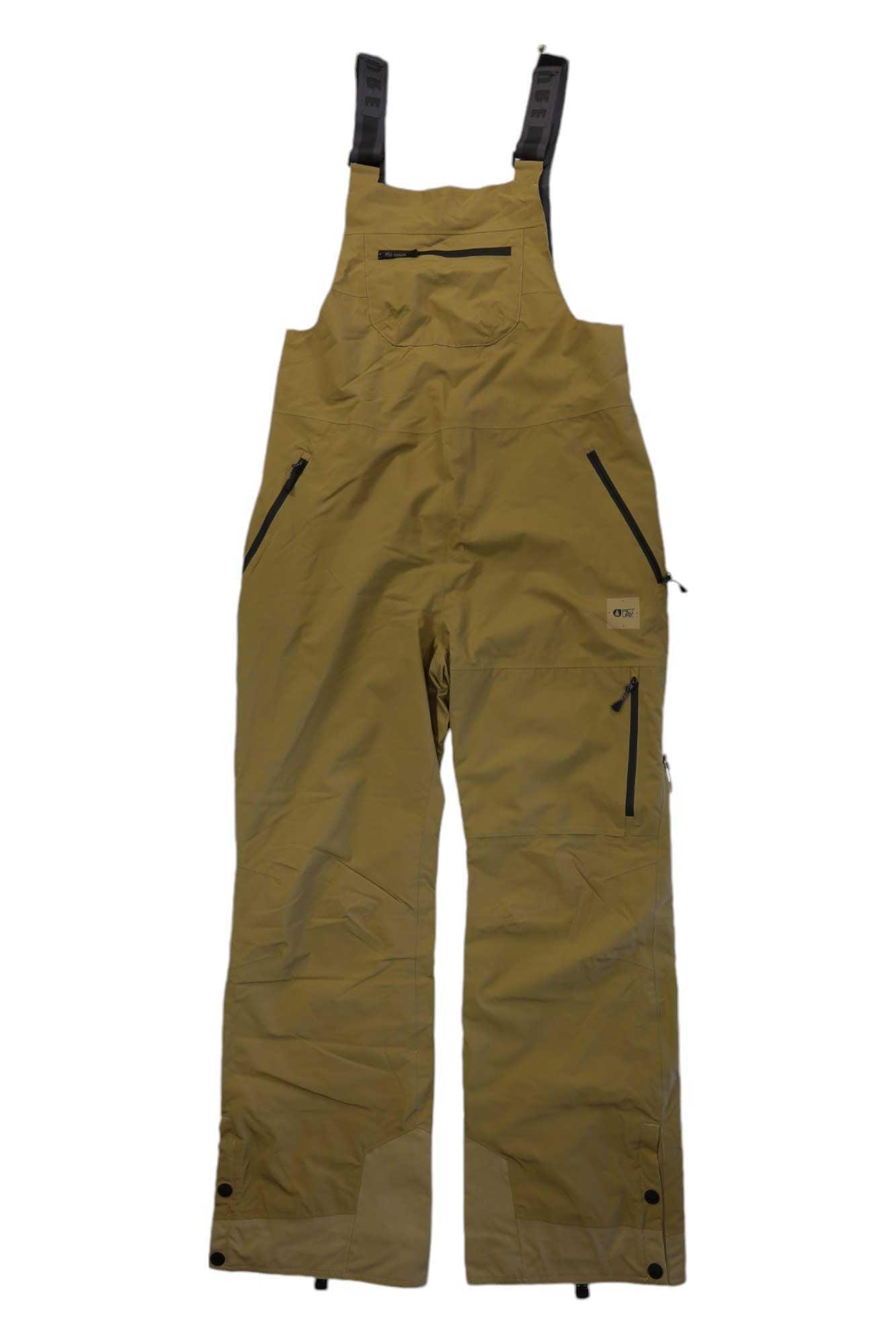 The Picture Womens Elwy Bib Pant features a tan waterproof design with adjustable black shoulder straps, multiple zippered pockets on the chest and legs, and snap closures—perfect for outdoor work or as upgraded women's snow bibs.
