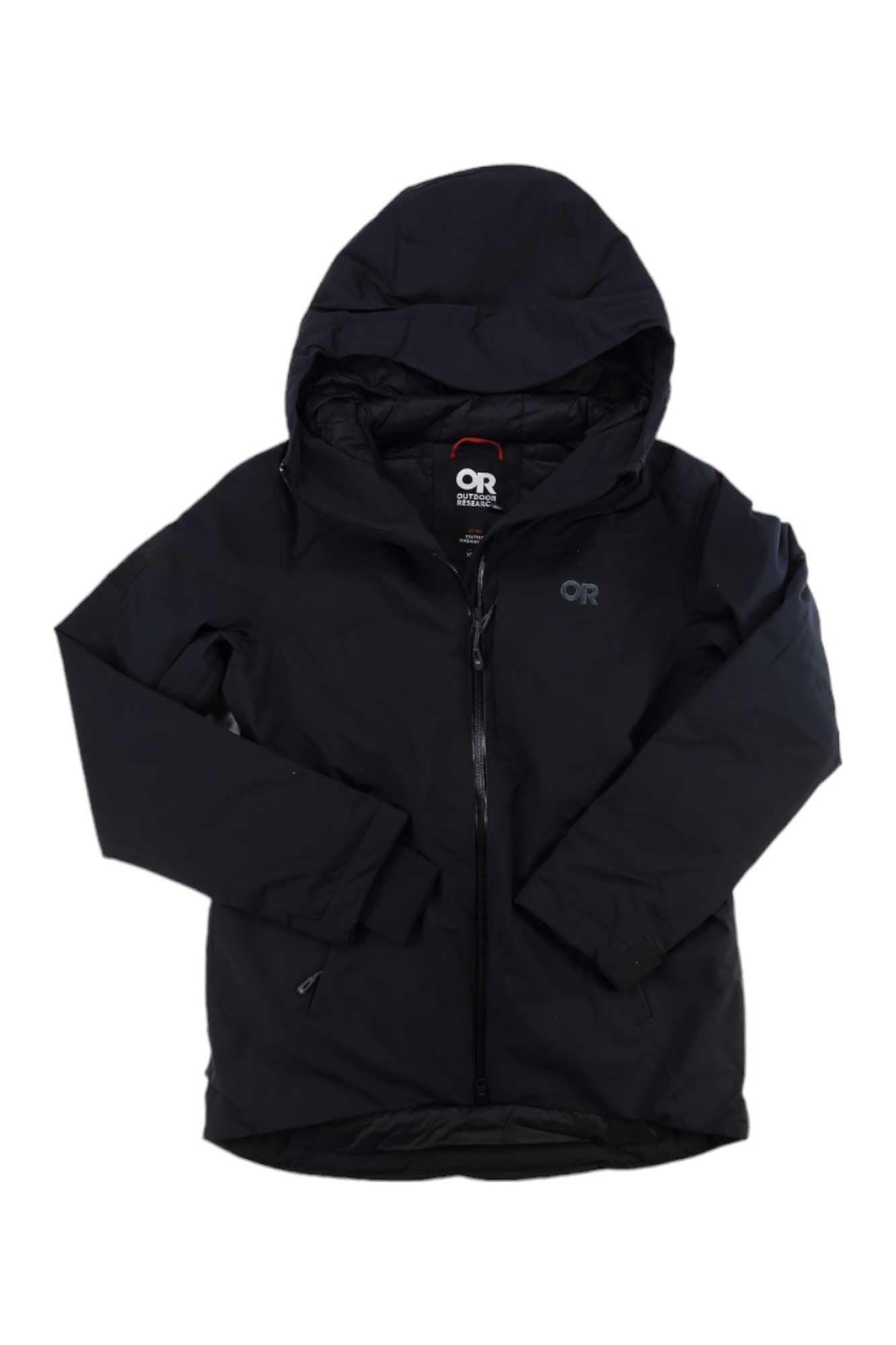 The Outdoor Research Women's Snowcrew Jacket is a black waterproof winter coat with long sleeves, a front zipper, and the OR logo on the chest, shown laid flat on a white background.