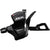 Close-up of a Shimano SLX SL-M7000 Shift Lever, an ergonomic black shifter with indicator window and lever for handlebar mounting. This lightweight bike component has the SLX logo printed on the top.