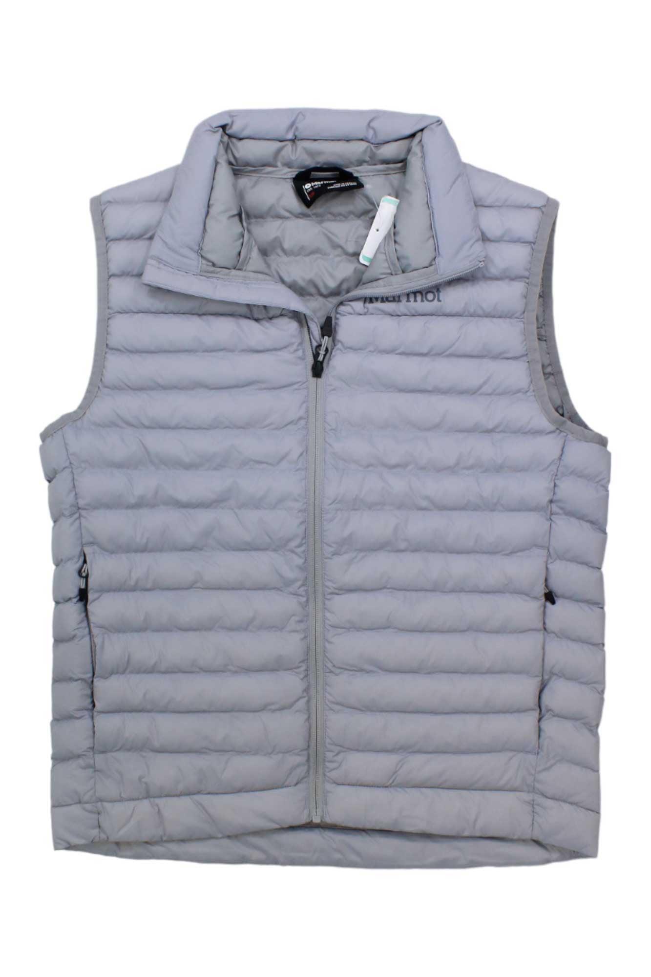 The Mens Echo Featherless Vest is light gray and sleeveless with horizontal quilted stitching, a front zipper, zippered side pockets, high collar, small chest logo, recycled nylon shell, and 3M Thinsulate featherless insulation for warmth.
