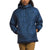 A person wearing The North Face Mens Circaloft 1/4 Zip Pullover—a blue, hooded, quilted jacket with synthetic insulation and side pockets—paired with tan pants and standing against a plain white background.