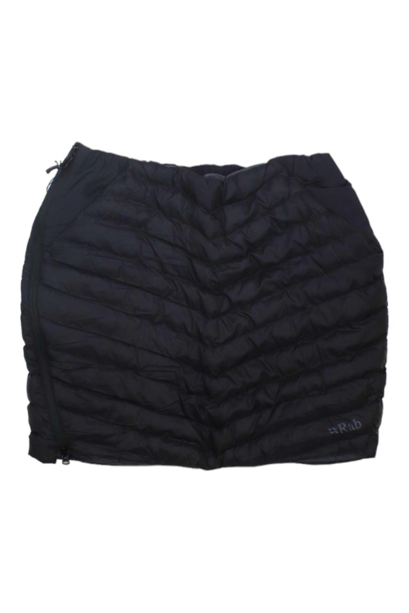 The Rab Women's Cirrus Skirt is a black, quilted insulated skirt featuring Primaloft fill for warmth, a side zipper, and the Rab logo on the bottom right.