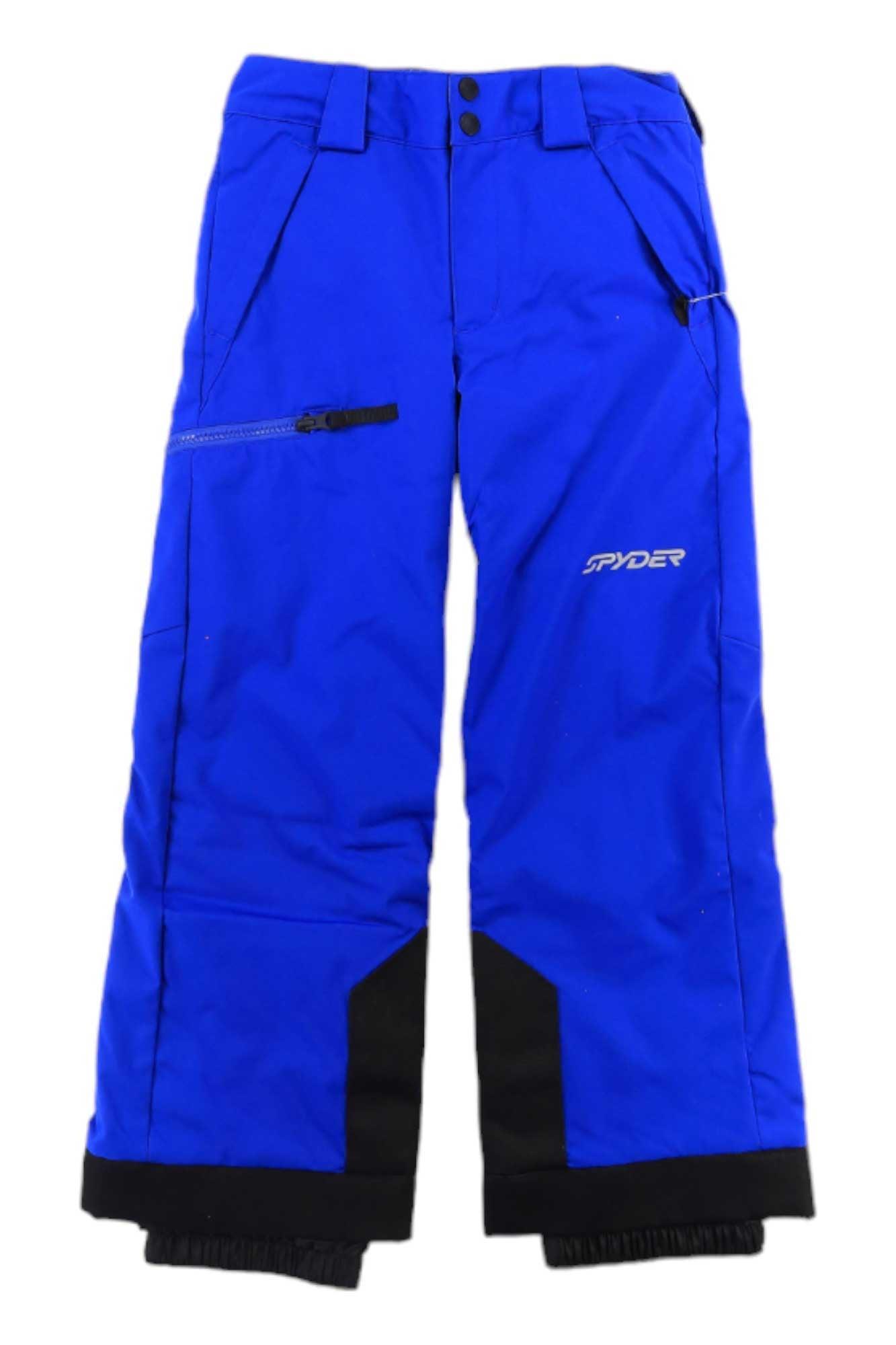 The Spyder Boys Propulsion Pant features bright blue, waterproof fabric with black reinforced cuffs, zipper details, multiple pockets, a Spyder logo on the right leg, belt loops, and an adjustable waist for comfort.