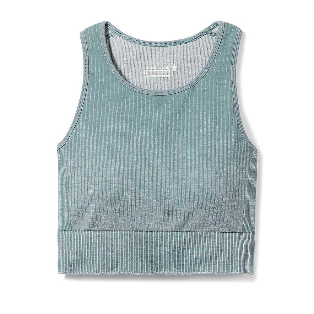 The Smartwool Womens Intraknit Crop Bra is a sleeveless, light teal ribbed crop top with a round neckline and wide hem, inspired by a merino wool sports bra—perfect for low-impact activities. Pictured laid flat on a white background.
