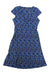 The Toad & Co Women's Rosemarie Dress is a short-sleeved, knee-length organic cotton dress featuring a blue and green floral pattern on a dark background, shown flat on a white surface.