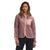 A woman with long hair wears The North Face Womens Mountain Sweatshirt Hoodie, a light pink insulated zip-up with a chest pocket, over a white shirt and black pants, standing against a plain white background.