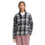 A woman with long, light brown hair wears The North Face Womens Berkeley LS Girlfriend Shirt—an organic cotton, plaid, long sleeve button-up—over a white top and pink cargo pants, standing with one hand in her pocket against a plain background.