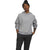 A person wearing The North Face Women's Chabot Hoodie in light gray, a black beanie, and dark pants stands with one hand in their pocket and the other by their side against a white background.
