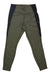 Sherpa Women's Kalpana Hike Tight in olive green features black side panels and zippered hip pockets, shown laid flat on a white background.