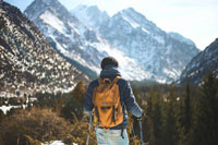 A hiker looking at a mountain range