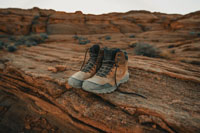 hiking boots with canyon in background