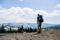 man with hiking daypack on back