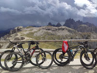 bikes propped against a wooden fence