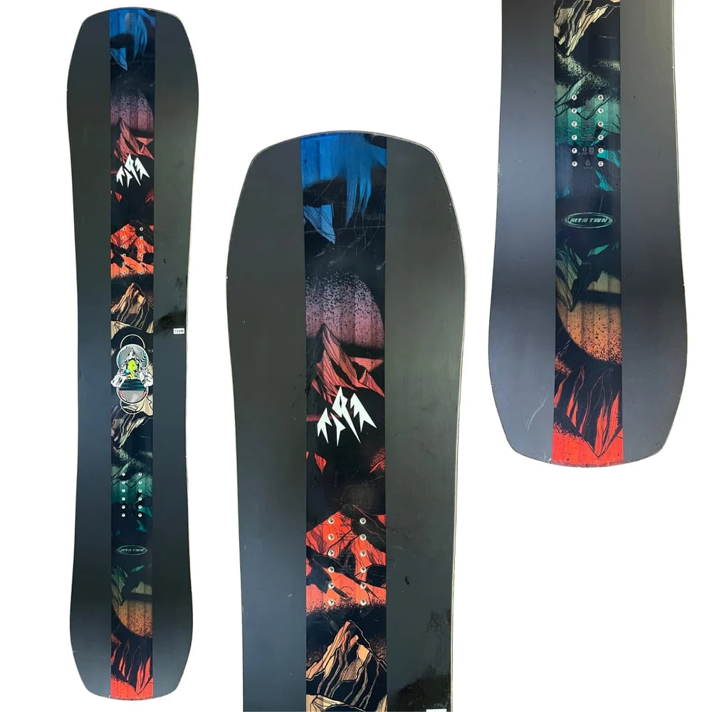 Black twin snowboard with colorful geometric graphic and mountain-style art panel