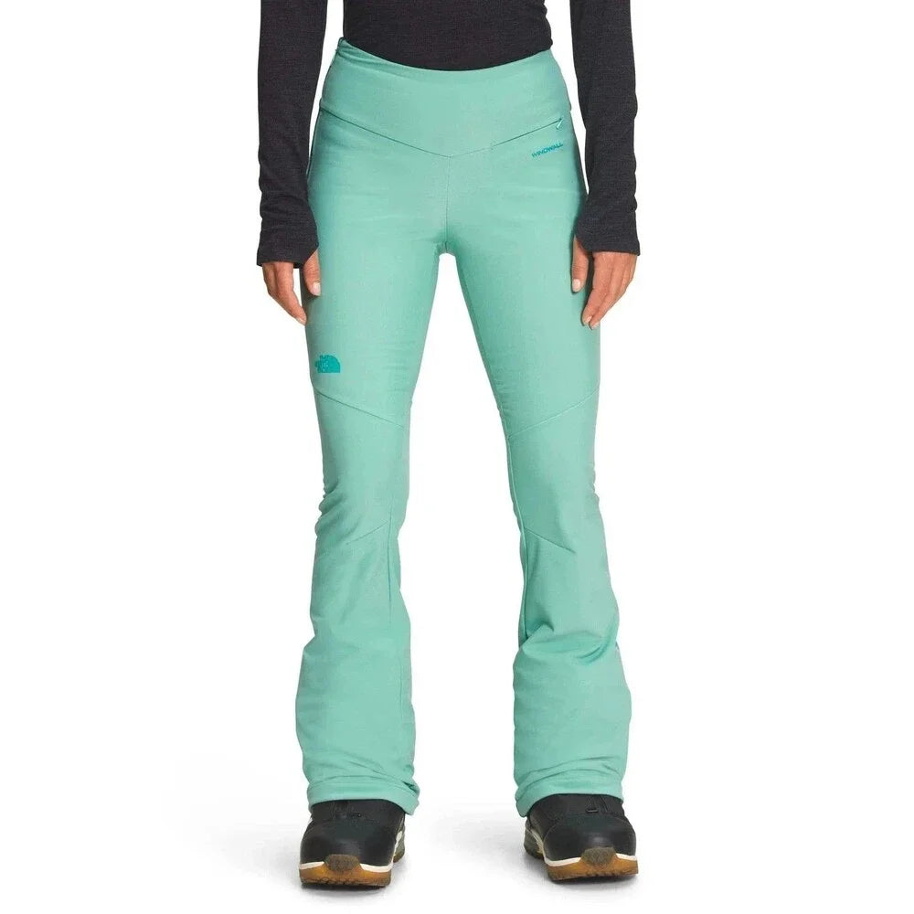 Women's mint green snow pants with tapered legs and ankle cuffs