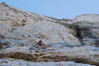 man climbing rock