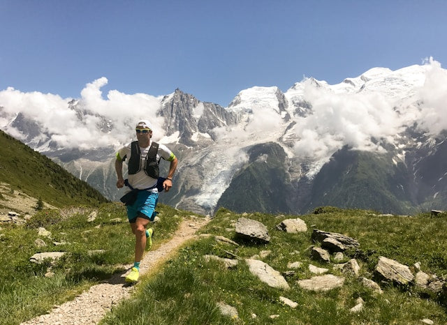 man jogging on a mountain trail