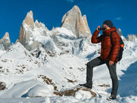 man standing on a snowy mountain