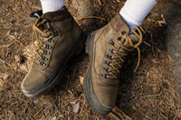 A man wearing men’s outdoor boots