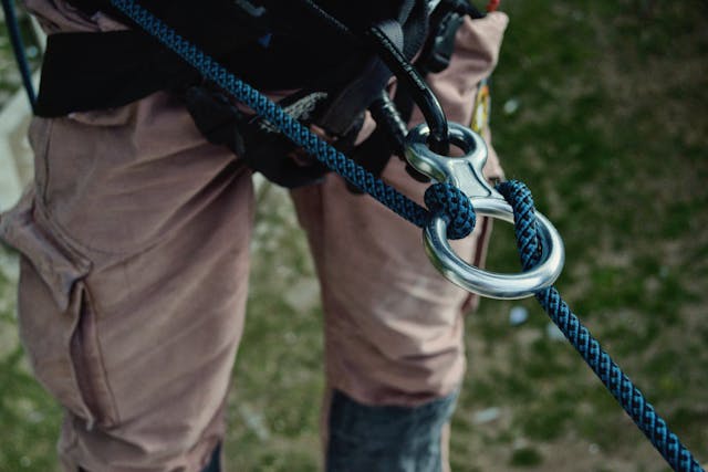 man wearing a rock climbing harness