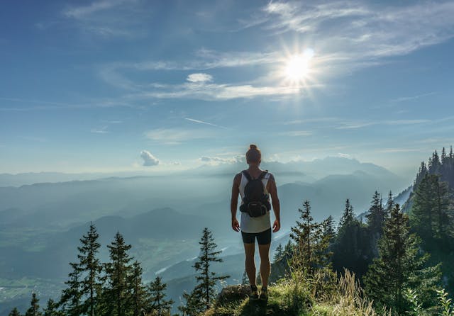 person standing on a mountain