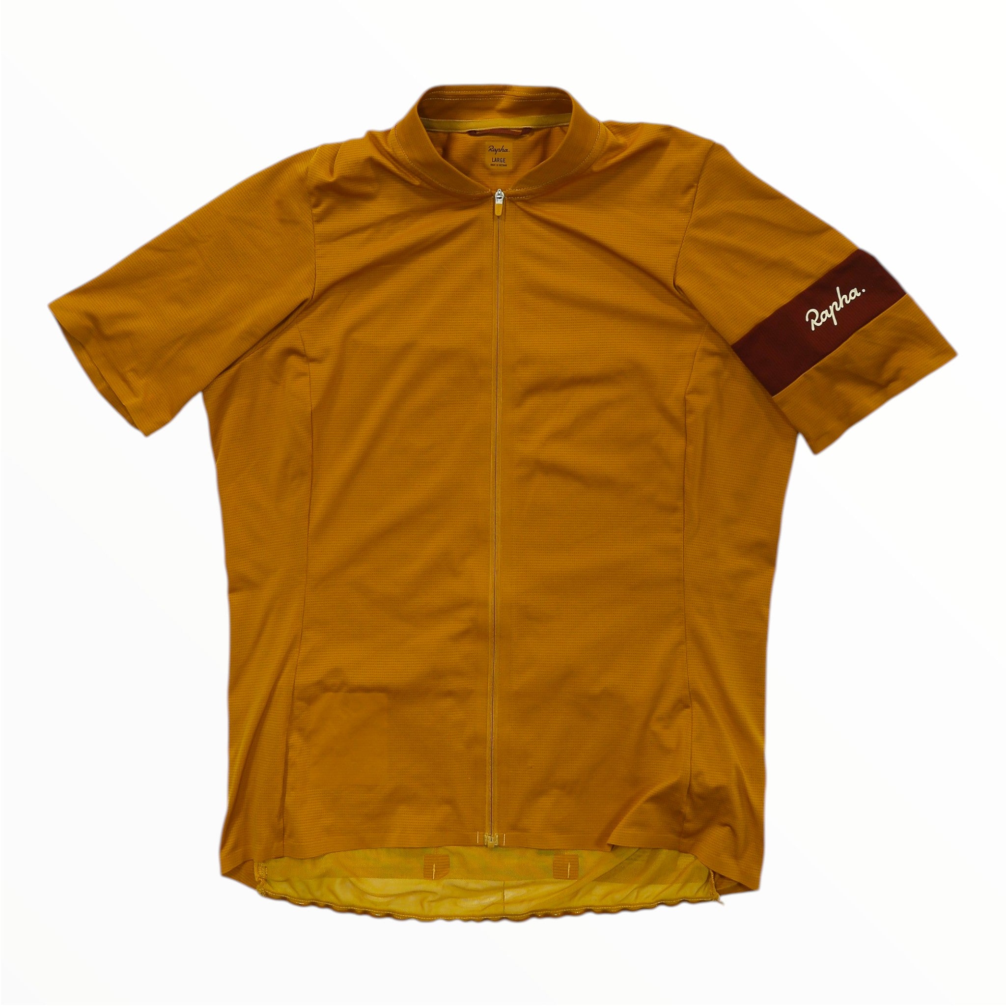 The Rapha Womens Classic Flyweight Jersey is a lightweight, short-sleeve cycling jersey in mustard yellow, featuring a full front zipper and the Rapha logo on a maroon band on the left sleeve, designed for optimal comfort and performance.