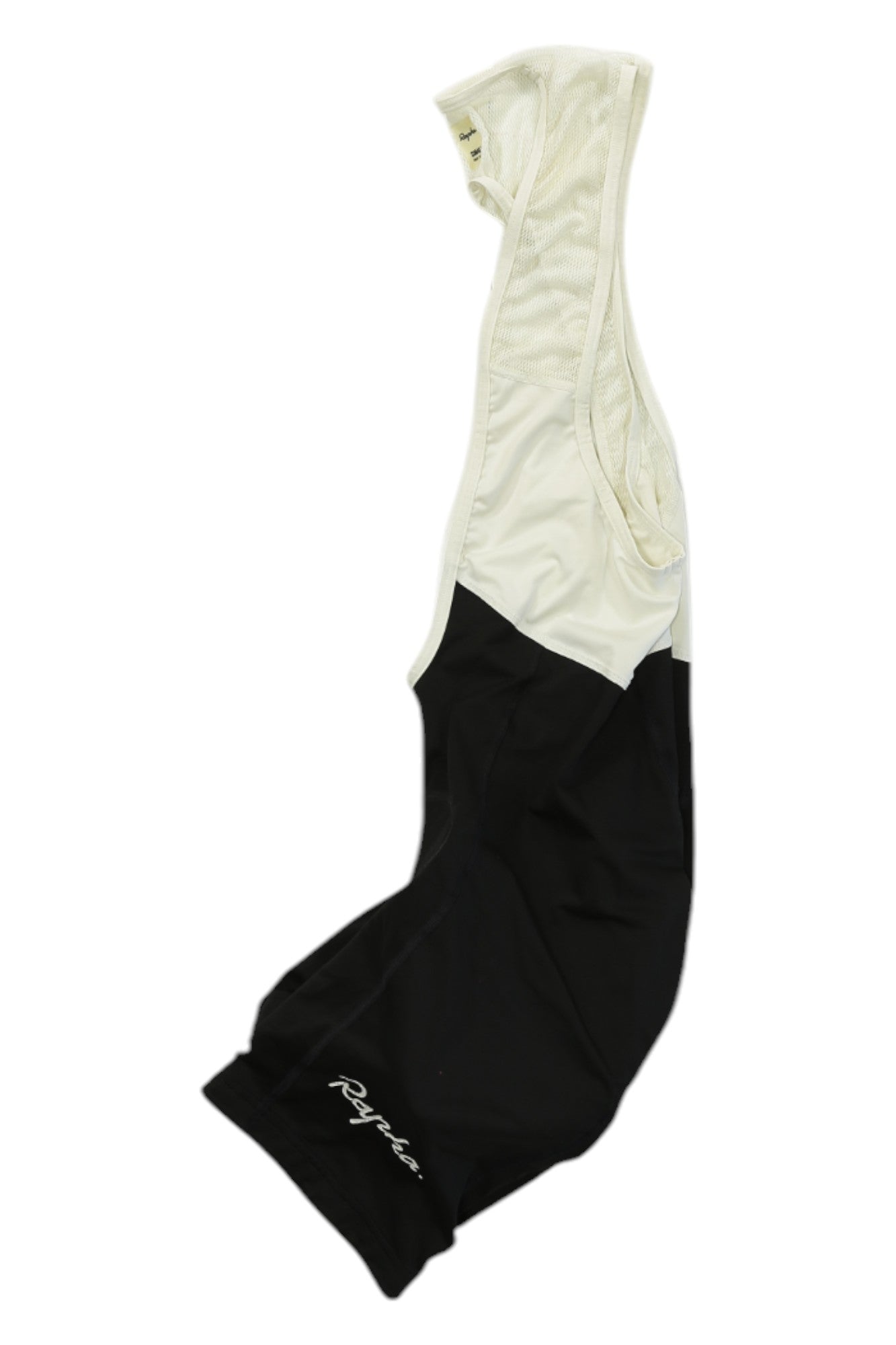 A pair of Rapha Classic Bib Shorts in black and white with shoulder straps and the Rapha logo on the left leg, designed for premium cycling performance, laid flat on a white background.