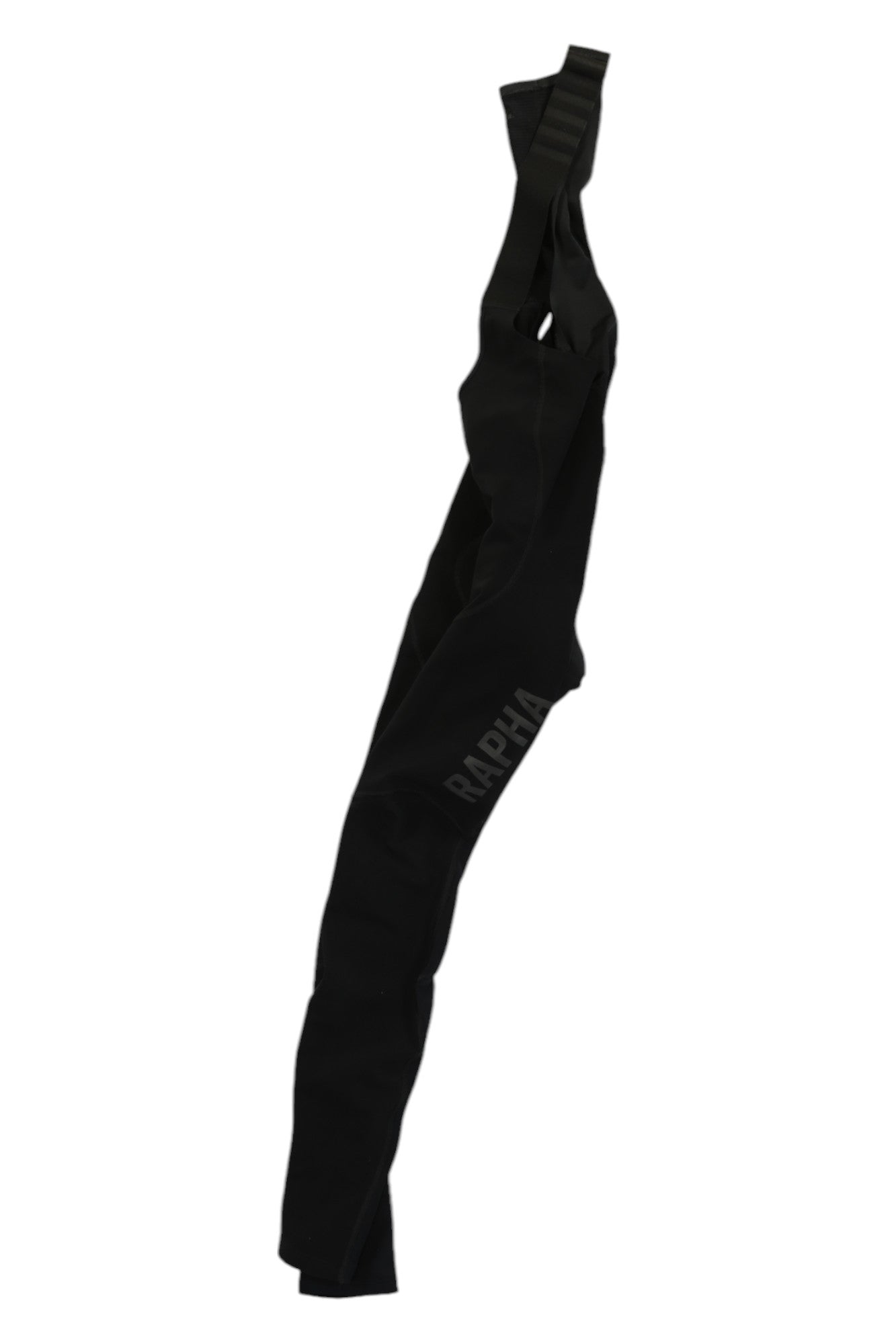 Rapha Men’s Pro Team Winter Tights with Pad II in black, featuring shoulder straps and shown hanging against a white background. The signature RAPHA branding is printed vertically on the upper leg, showcasing the distinctive style of Rapha.