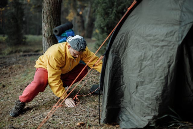 a man setting up a tent