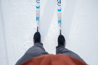 A skier’s view of their skis and boots