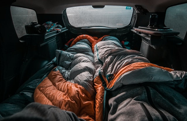 Two sleeping bags in the back of a vehicle