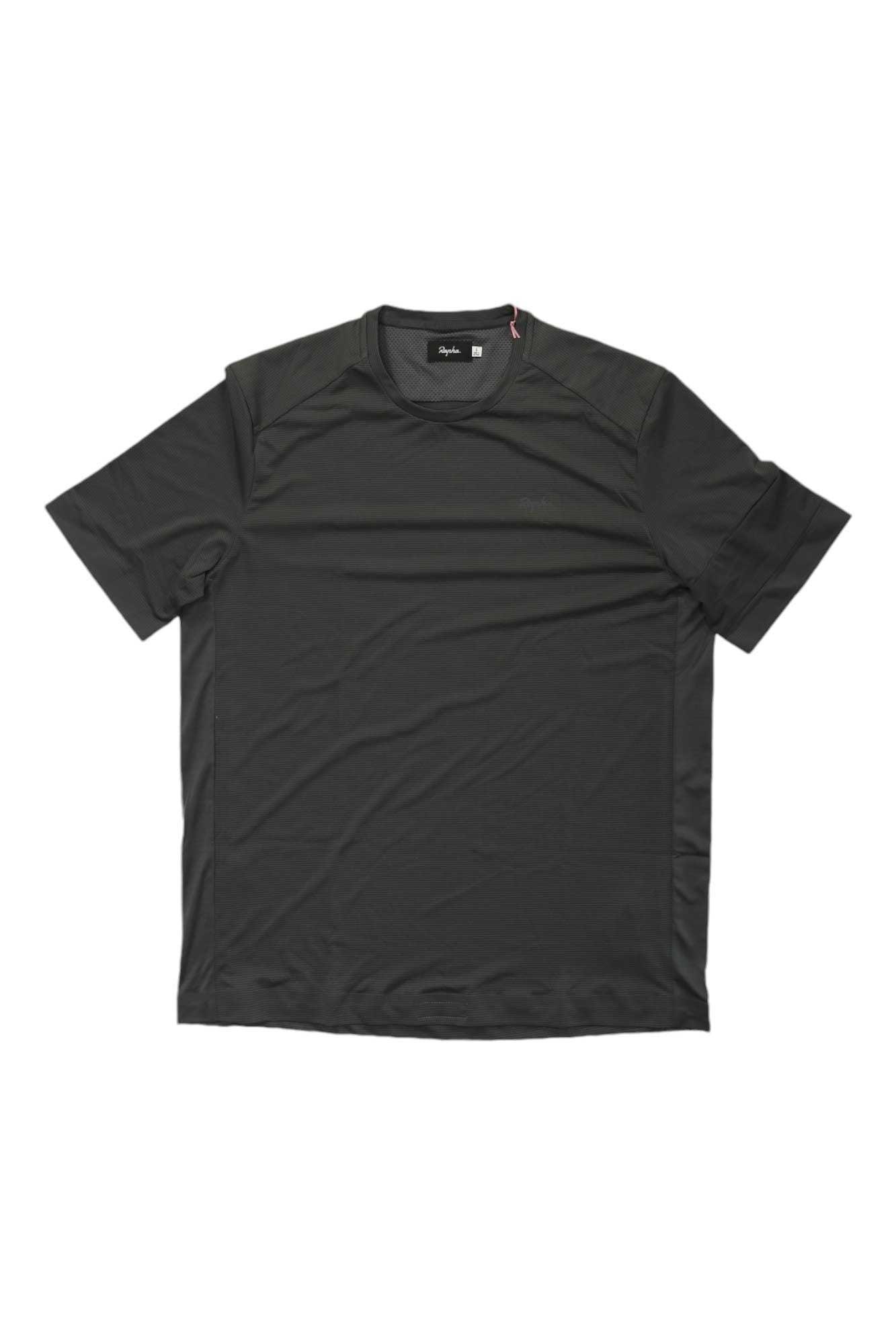 A plain black Rapha Explore Technical T Shirt is displayed on a white background. This lightweight, breathable cycling t-shirt features a classic crew neck and has no visible patterns, logos, or graphics.