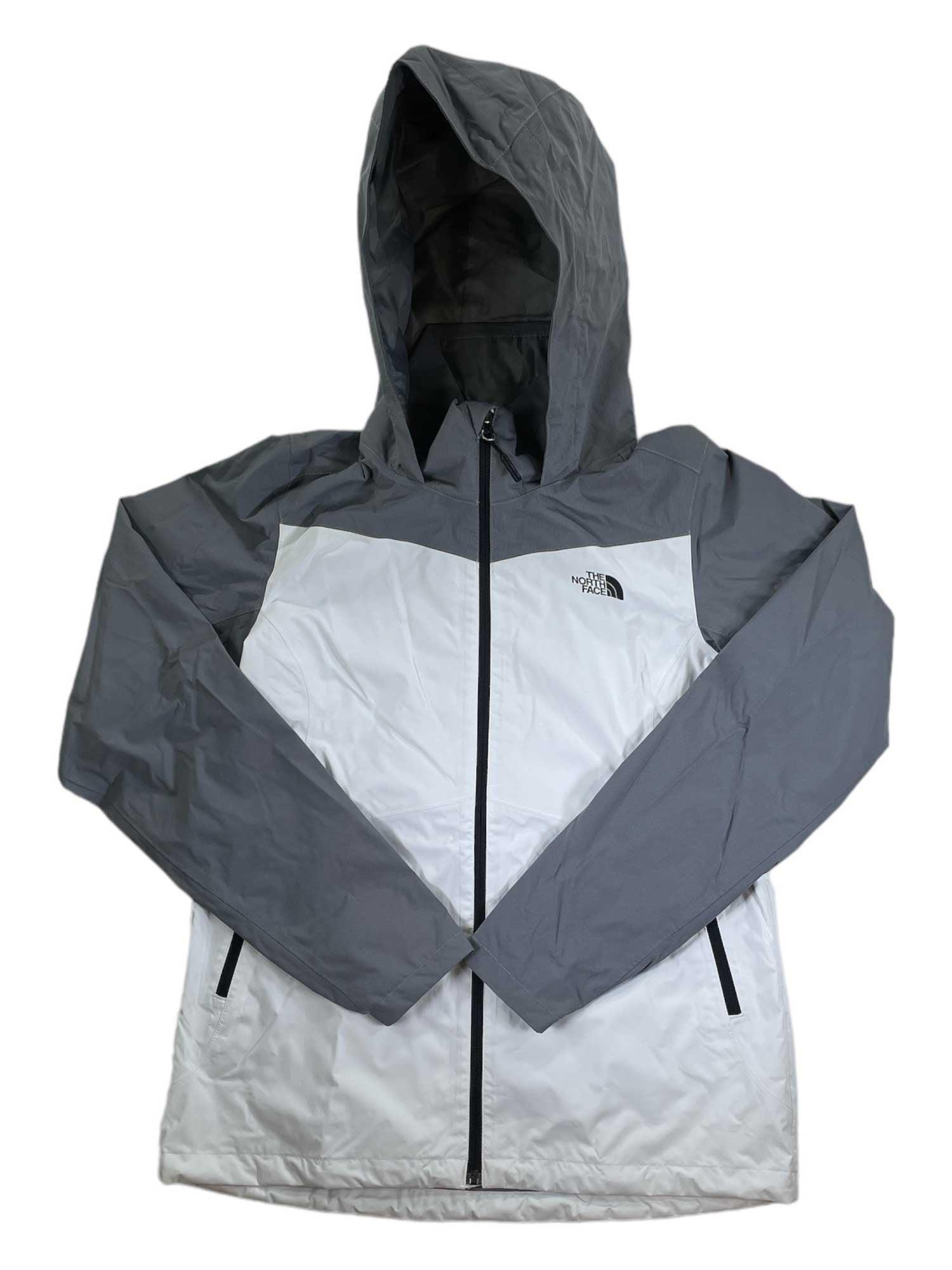 The North Face Women's Resolve Plus Rain Jacket is a two-tone waterproof jacket with light gray sleeves and hood, a white body, black zipper, and a small black logo on the left chest.