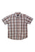 The Mens Prana Tamrack Short Sleeve Shirt is a standard fit, collared button-up with plaid in white, gray, blue, and rust red organic cotton. Shown laid flat on a white background.