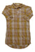 The PRANA WOMENS DERYN DRESS is a long, collared plaid shirt dress with front buttons, rolled-up buttoned cuffs, and organic cotton in muted mustard yellow, pink, and beige stripes—ideal for casual outdoor wear.